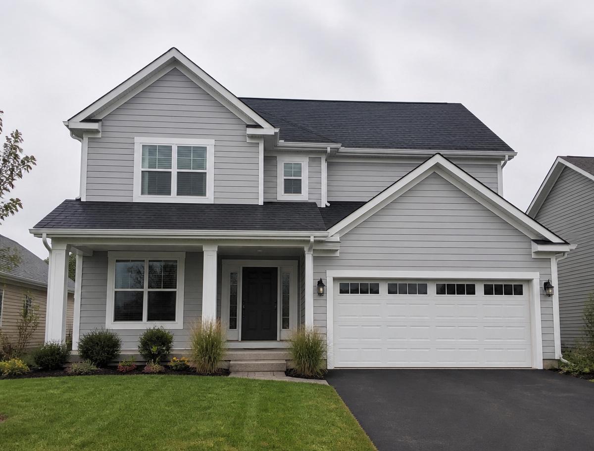 Same two-story home with new charcoal shingle roof installed